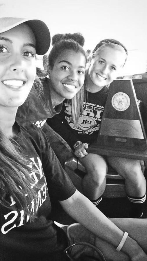 West tennis team pictured with their State trophy.
