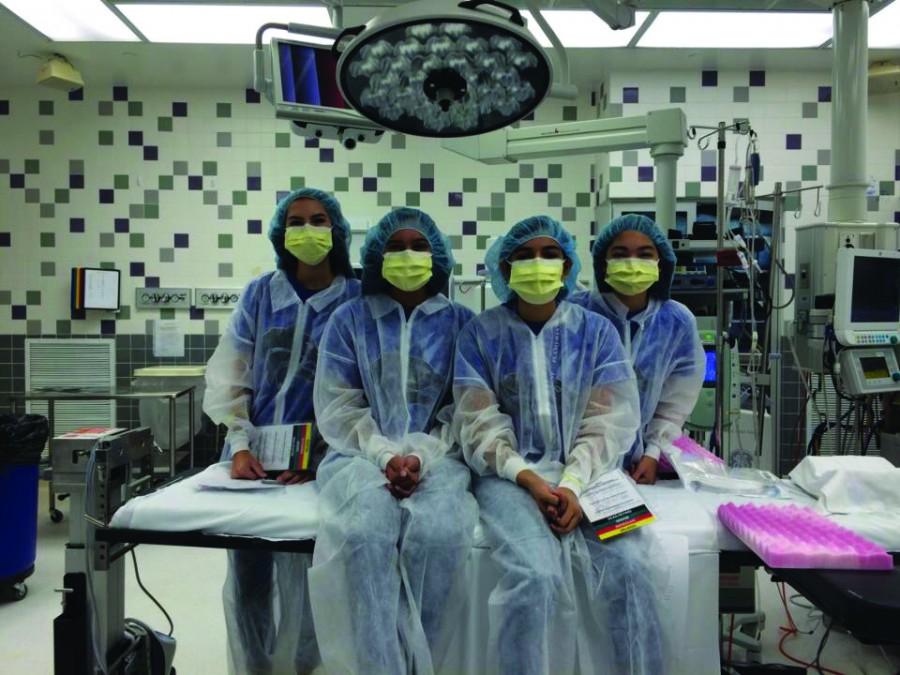 Students prepare for disaster drill at Presbyterian hospital. . Left to Right: Nicole Neustifter, Suman Vadlamami, Gauri Ketkar, Claire Nguyen. Photo Submission.