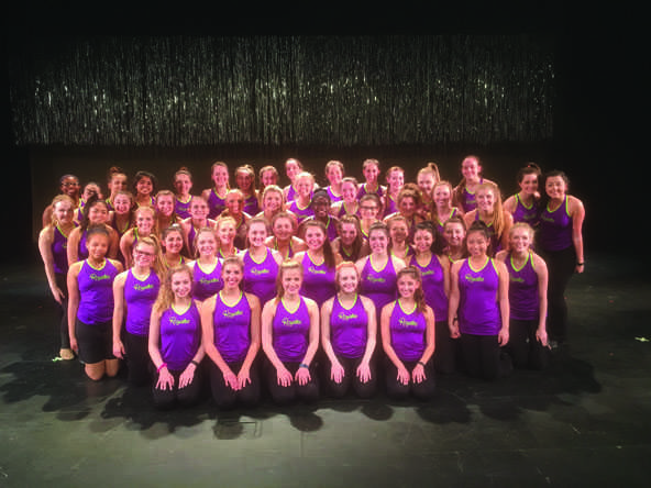 Taking a break from practicing on stage for spring show, the Royales pose for a team photo.