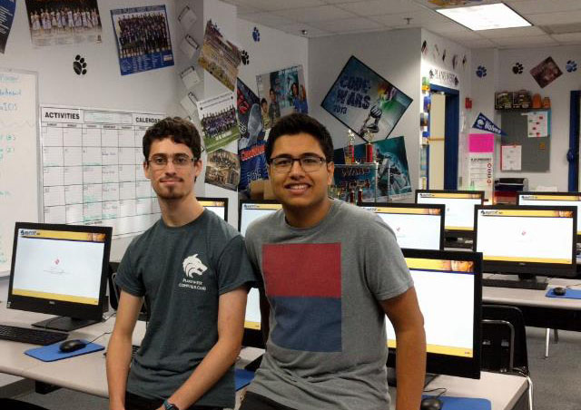 Seniors Ari Cohn and Ritvik Annam stand in AP Computer Science lab, E501.