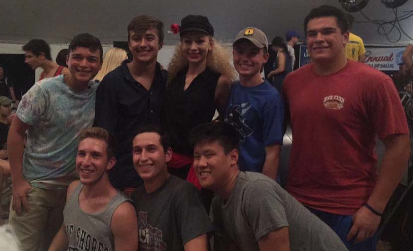 Avy Taylor poses with friends after her night performance at the Holy Greek Orthodox Church.
