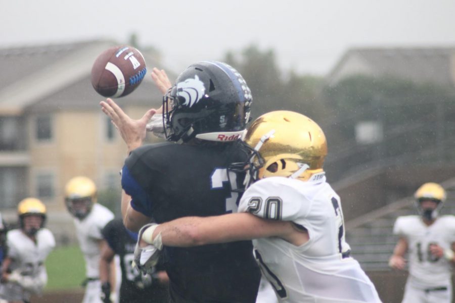 Plano West's Wyatt Johnson (#3) reaches for the ball against a Jesuit player.