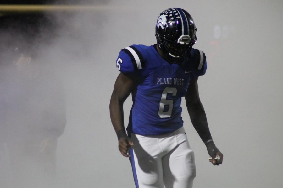 Defensive end Shemarl Pearl (#6) exits the tunnel before kick-off against McKinney