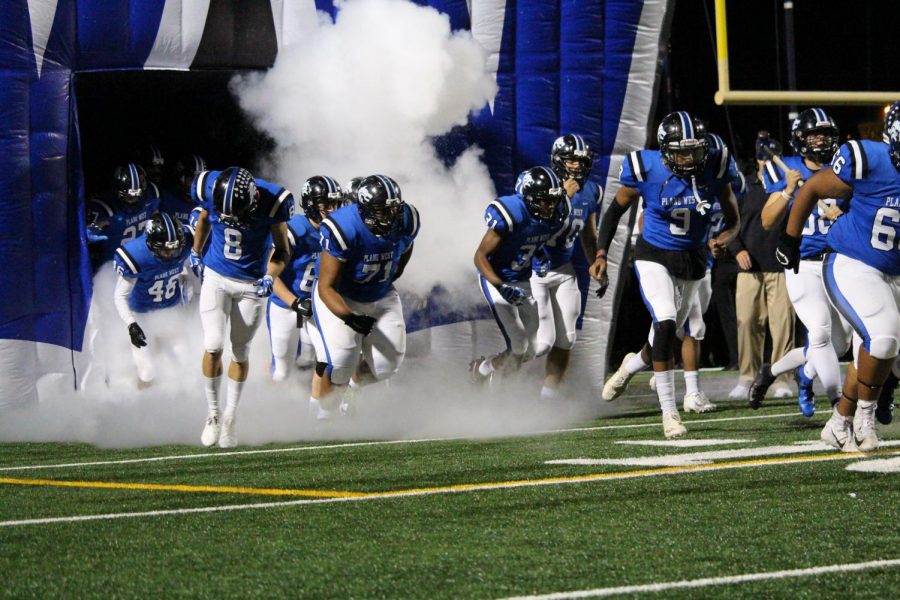 Plano West running out of the tunnel last Friday against Plano East.