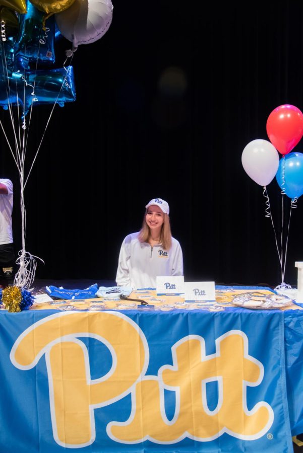 Blaire Bayless poses for a picture at her signing table.