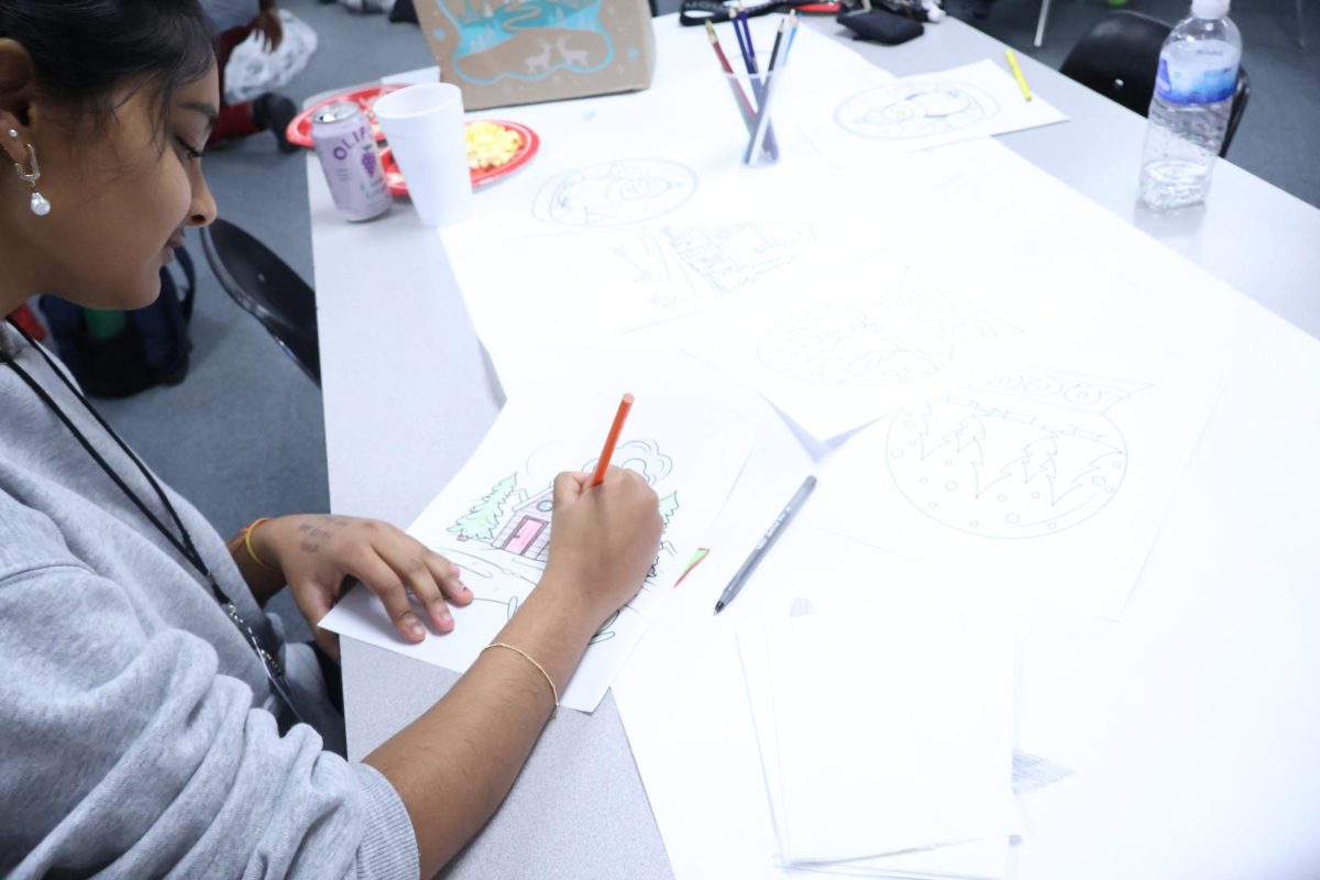 To help students prepare for finals, junior Nikharr Neeraj colors at the student council and AVID HoliStayDay study session Tuesday, Dec. 9. 